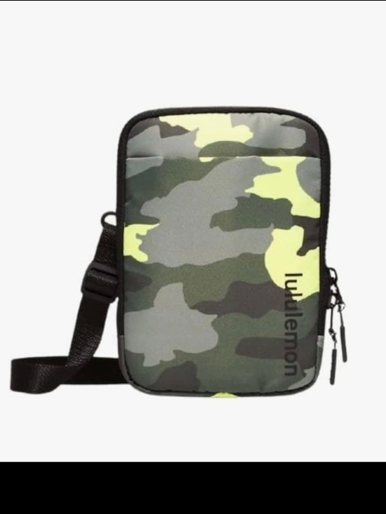 lululemon athletica Handbags - lululemon athletica mini bag in black with pink camo interior
